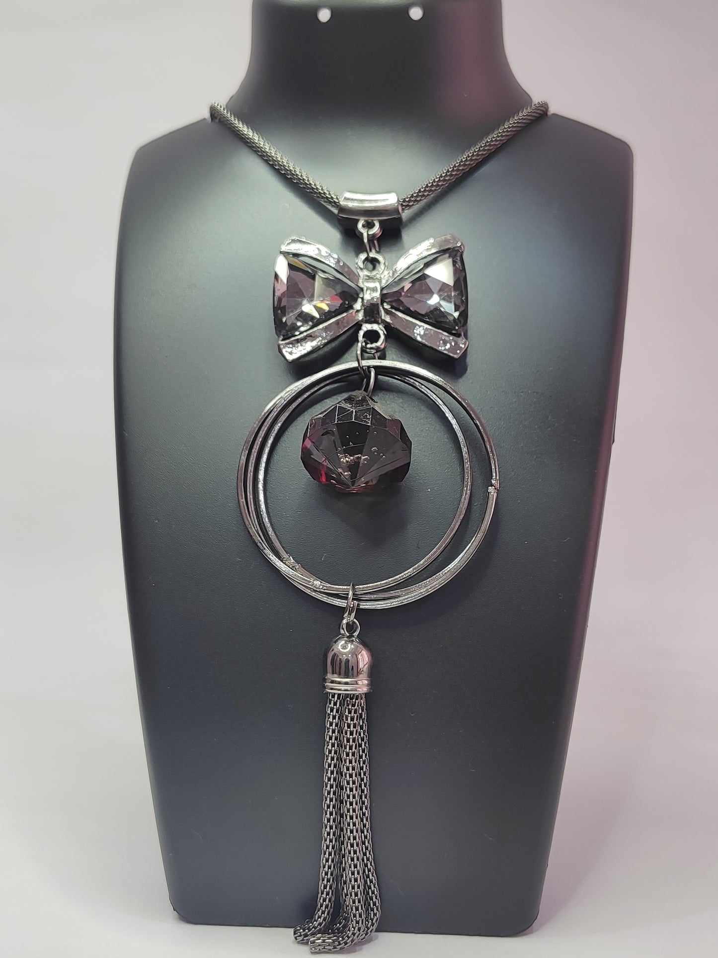Dark Silver Tone Bow Necklace with Black Faceted Stone & Multi-Chain Tassel
